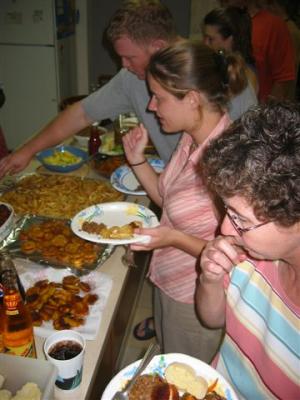 Martha, Gale and Jeremy go through the food line