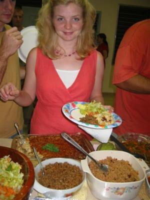 Jenny trying out the rice and beans