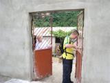 cleaning cement off the doors to paint them