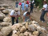 everyone is to carry 2 rocks to put in the creek so the trucks do not get stuck