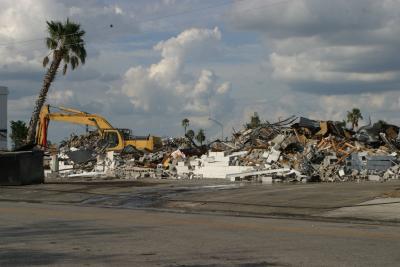 Parking lot nearby full of collected debris.