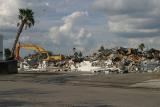 Parking lot nearby full of collected debris.