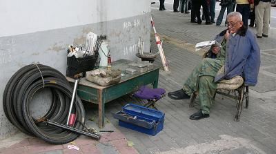 Fixes Bike Tires, Beijing