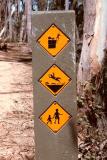 Another weird sign by the Parks department - watch the cliffs, ground is slippery, and watch out for kids?