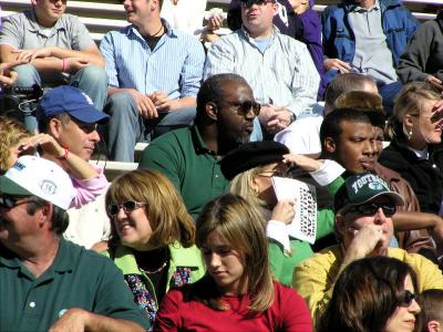 Father (green shirt center) of #25