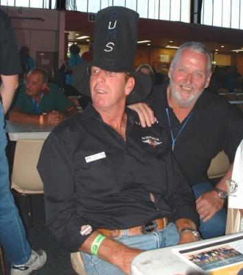 Mick borrows Chuck's hat.