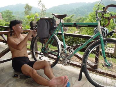 Ming checking his bike