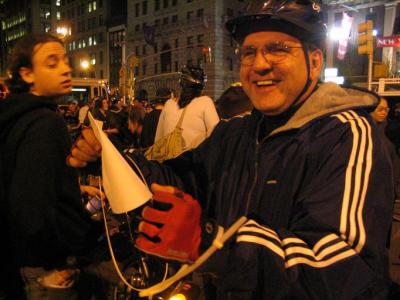 John Chiarella (holding a copy of the riot act) in his plastic handcuff costume at NYC's annual Halloween Party on two wheels

 2004 Steven Faust. all rights reserved