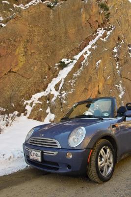 Sunlight striking the canyon wall shows in the side of the MINI Convertible.

