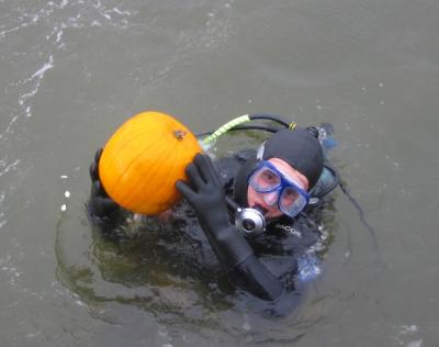 Tom in the water with his pumpkin