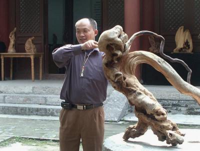 Sculptor with his work