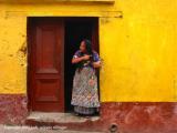 brushing her hair and the yellow wall, santa maria de jesus, guatemala