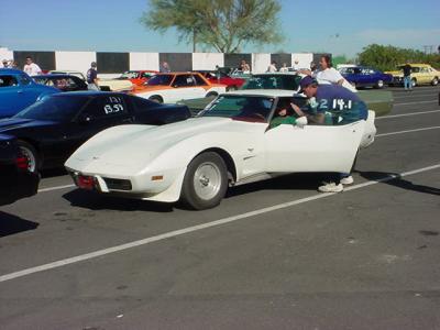 white Corvette <br>getting ready to race