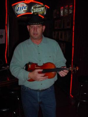 Chuck plays the fiddle  and the mandolin