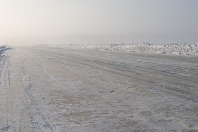 Road on the river into fog