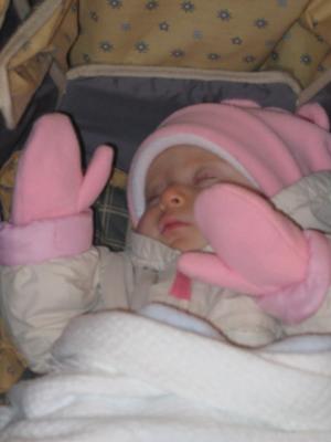 She is asleep with her hands up