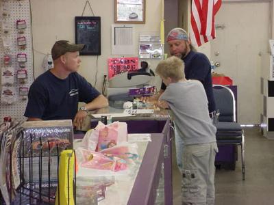 Keith, Levi and Mark  talking about racing