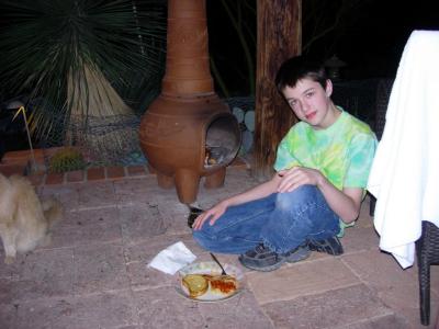 Back at the Casita - Leo braves chimnea fire for Garrett's dinner