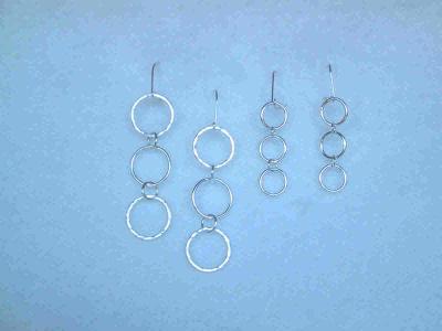 Hammered silver rings in various sizes.