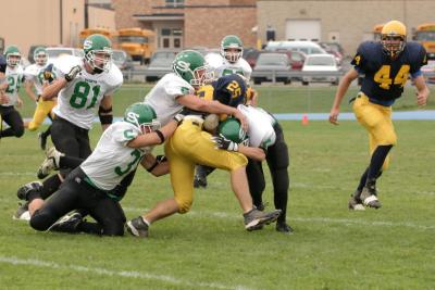Strong, Rossman & Olsen making a tackle