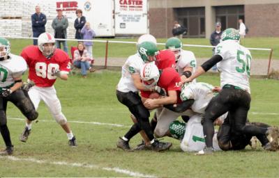 Tony Bartholomew, Josh Rebello & Jeremy Sedelmeyer tackling the RB