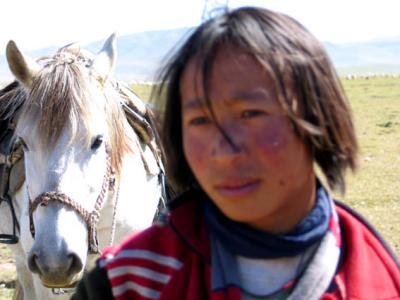 Nomad boy with horse