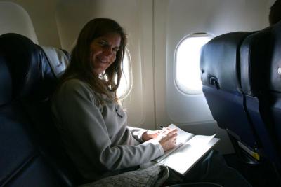Working on journal in smaller plane into Lisbon