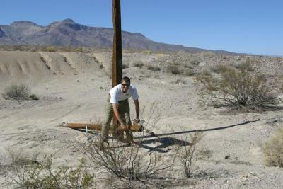 Jim, pulling down old wires to get the insulators!