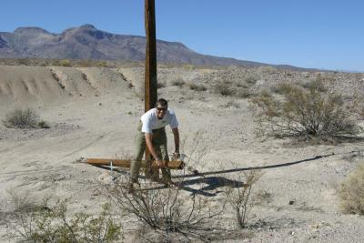 Jim, pulling down old wires to get the insulators!