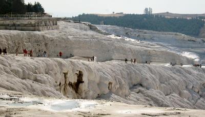 The terraces theyre walking past no longer hold much water (drained away to hotels).