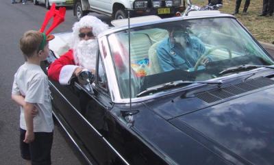Santa and Dick in the Mustang.