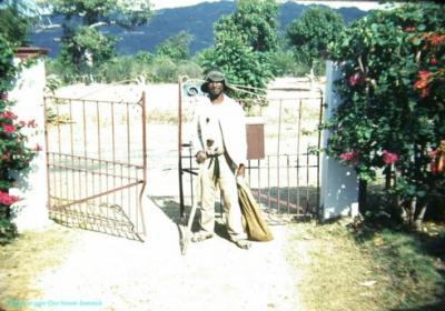 Island Jamaica Beggar at gate