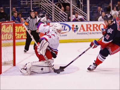 u5/skroll/medium/37121883.14LowellLockMonsterGoalieBrentKrahnmakesthasaveagainistHartfordWolfpackWingerChadWiseman.jpg