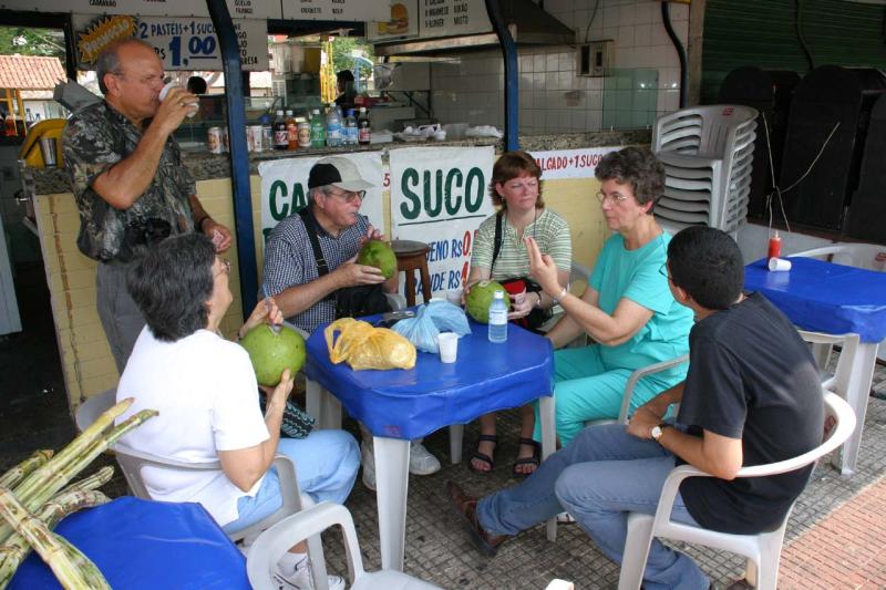 Enjoying sugar cane juice & coconut water