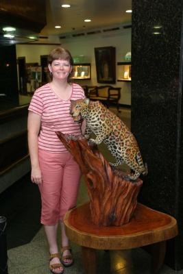Angela with carving of a jaguar at Hotel Tropical Manuas
