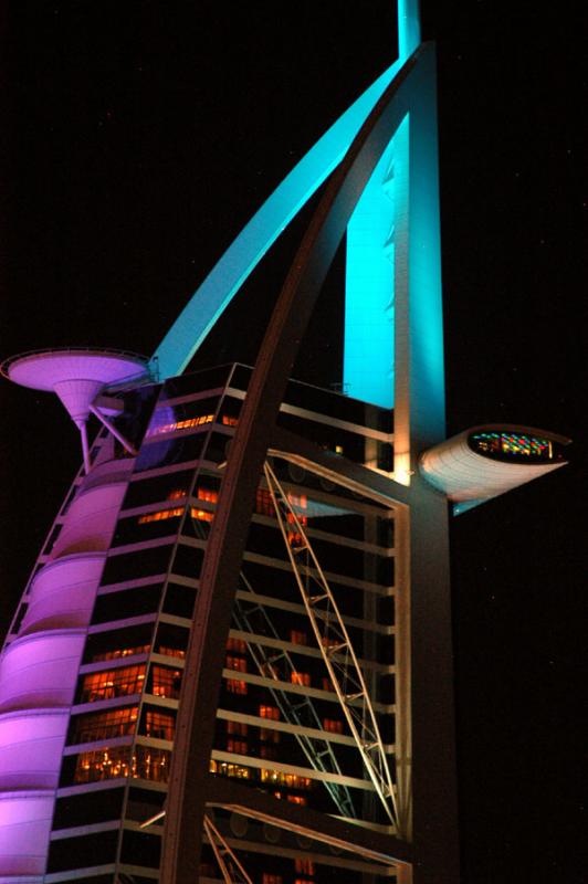 Top of the Burj Al Arab with multicolored floodlights