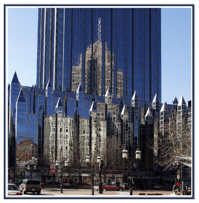 On the other side of the square, the PPG building reflects its neighbors.