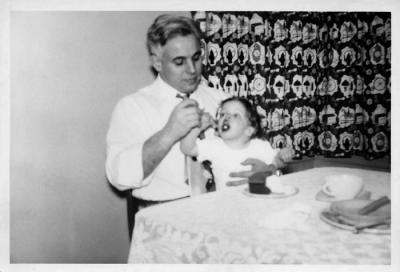 Dad feeding Mary, 1950 (271)