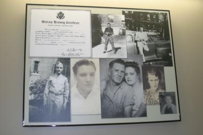 The walls in the waiting area are decorated with frames of old photos, reciepts certificates and memorabilia from the era