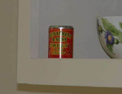 A can of snuff of the type used by his mother and grandmother