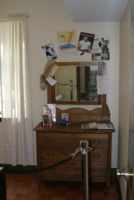 a bureau decorated with items Elvis might have had