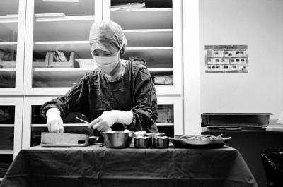 Scrub Nurse Preparing Surgical Instruments