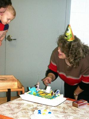 Jared's 1st Birthday Party. Mommy Lights the candle