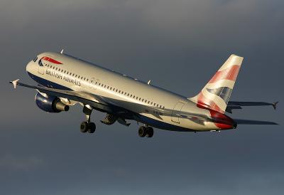 Airbus A320 departing Edinburghs Runway 24 in the fading December light