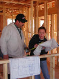 Joyce goes over wiring plan with electrician