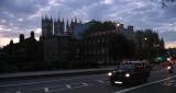 Westminster Abbey and black cab by night