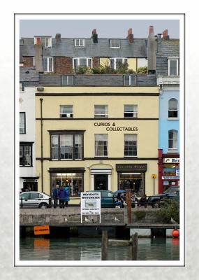 Harbourside shop with TrinityTerrace behind, Weymouth