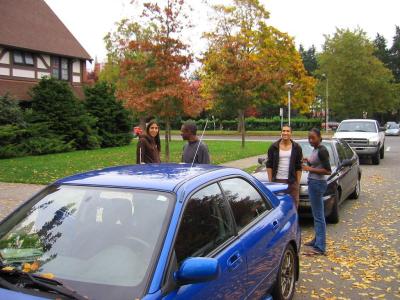 in the shiny blue car.