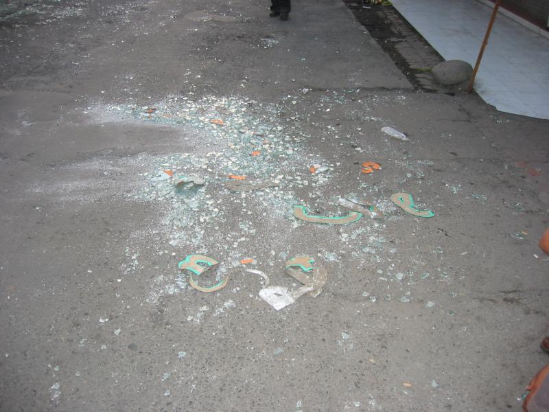 Bali, down poppies lane, broken glass on side walk from store front morning after bombing