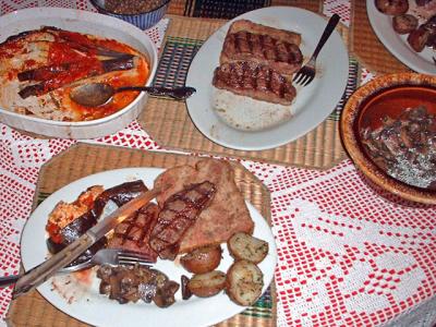 steaks served with eggplant parmesan, sauteed mushrooms, pan roasted potatoes
